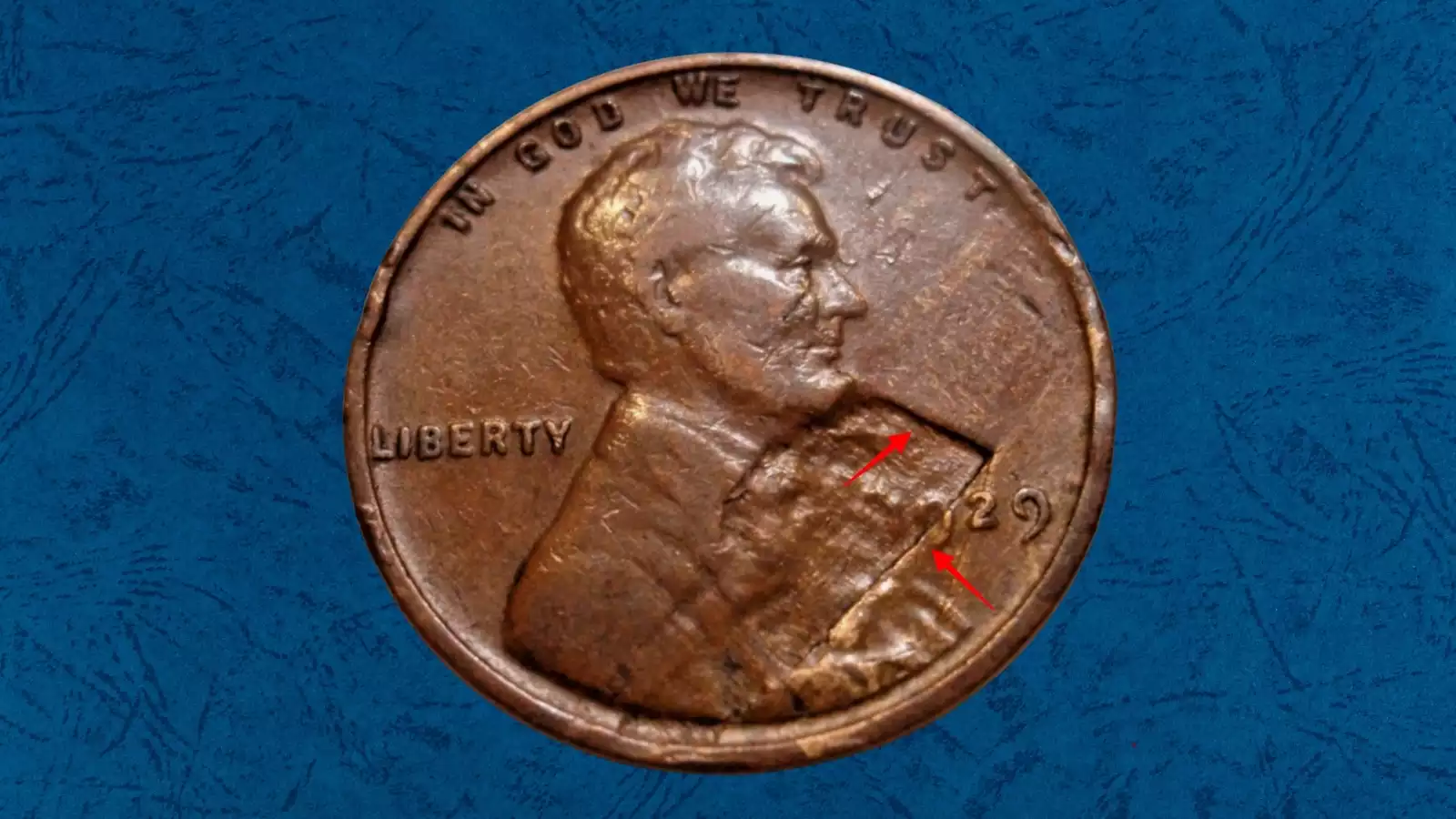 1929 wheat penny struck-through error showing missing design detail where foreign material was between die and planchet during striking